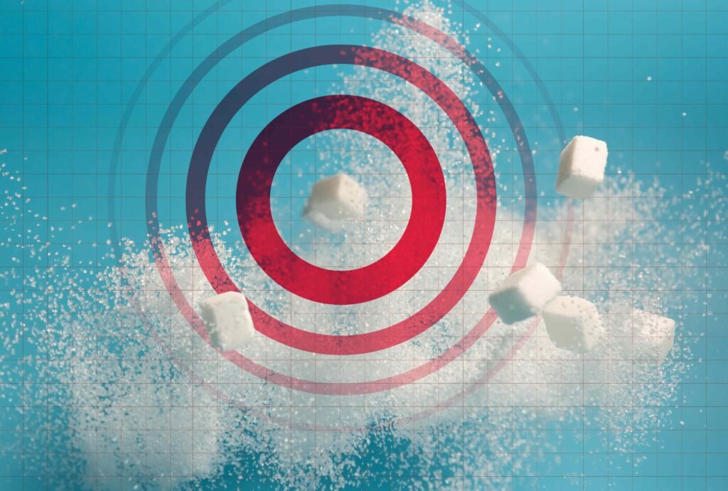 Cubos de açúcar e alvo vermelho em fundo azul com grade.