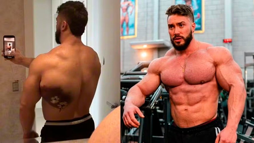 Homem musculoso mostrando costas e peitoral em academia e selfie.